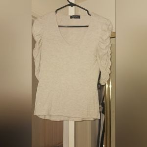3/4 runched sleeve double lined in the front to provide coverage, modest top